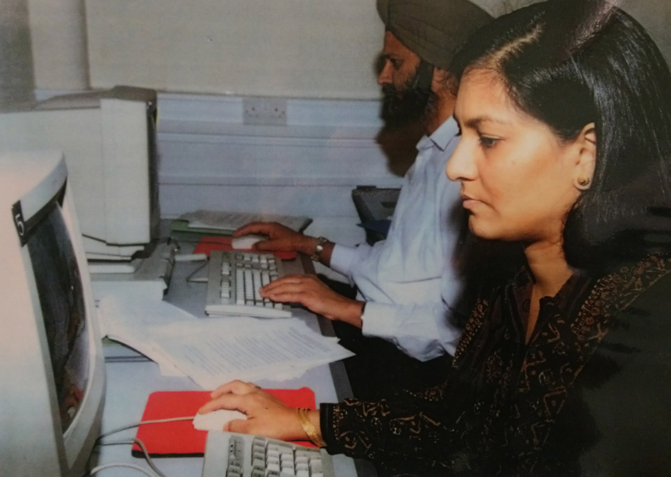 Photo from the 1990s of learners in a computer class