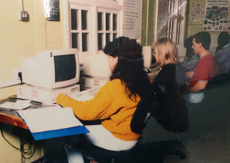 Photo from the 1990s of learners in a computer class