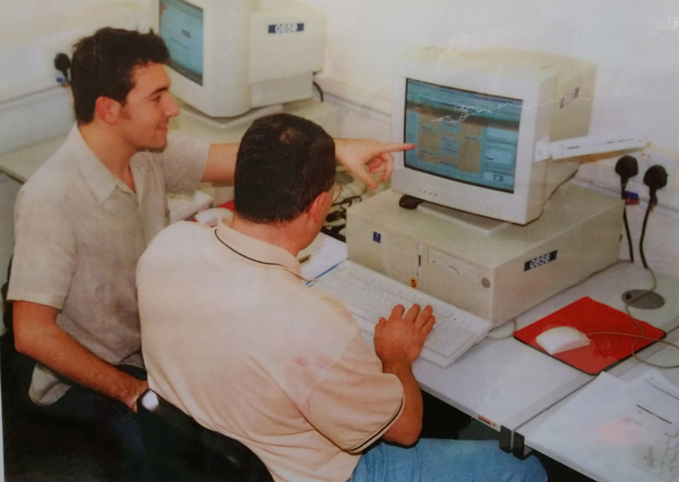 Photo from the 1990s of learners in a computer class