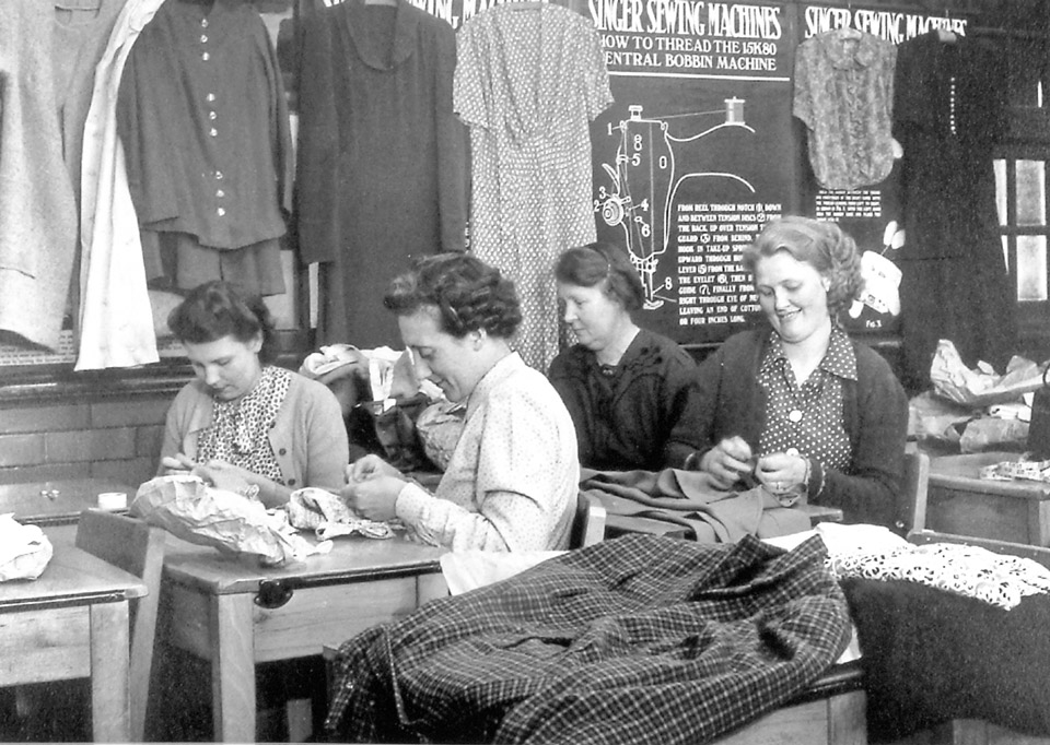 Photo from the 1940s of learners in a sewing class