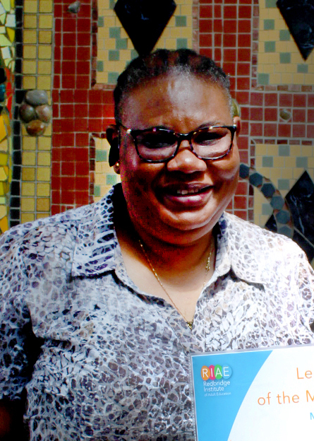 A photo of Adejoke Onuaguluchi holding a learner of the month certificate.