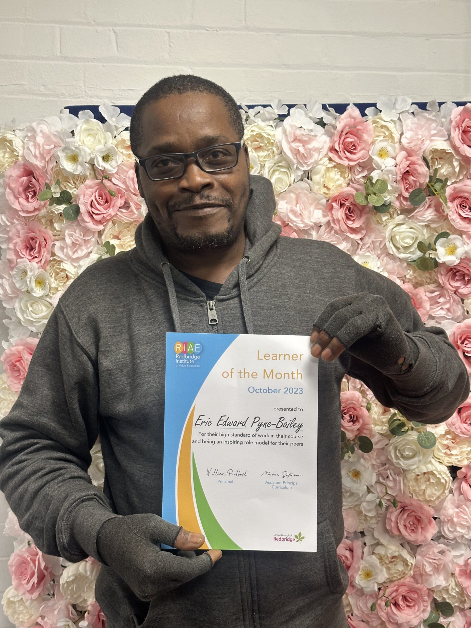 Photo of Eric Edward Pyne-Bailey holding his certificate